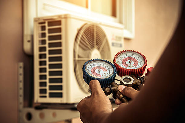 Professional Air Conditioning Service technician working in Vestaburg, PA